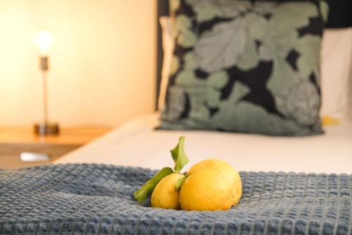 a pile of fruit sitting on top of a bed at The Lemon Tree in Ceres