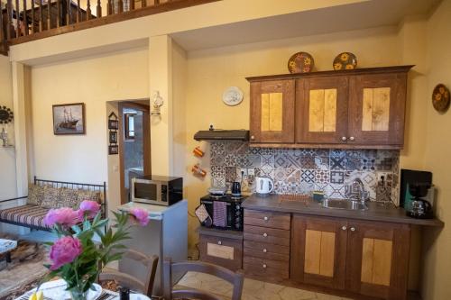 a kitchen with a sink and a counter top at okakosolykos in Kostitsi