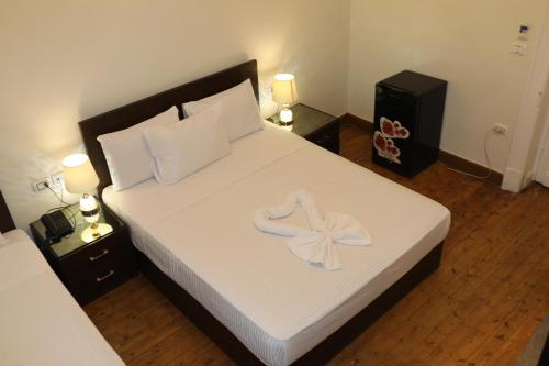 Cama o camas de una habitación en New Midtown