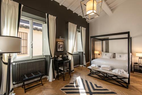 Postel nebo postele na pokoji v ubytování Relais Uffizi