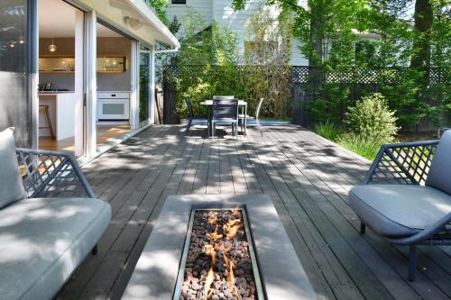 a patio with two chairs and a fire pit at Fitch St Escape A Wine Country Escape in Healdsburg