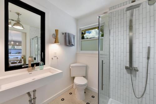 a bathroom with a toilet and a glass shower at Fitch St Escape in Healdsburg