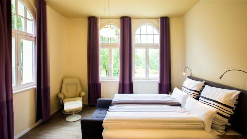 Postel nebo postele na pokoji v ubytování Parkresidenz Lychen, Ferienwohnung 7