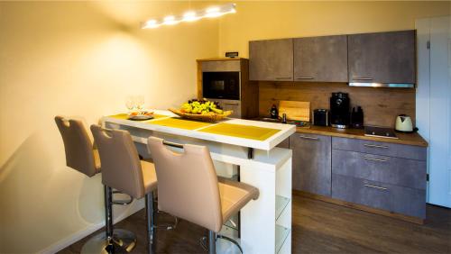 Kuchyň nebo kuchyňský kout v ubytování Parkresidenz Lychen, Ferienwohnung 7