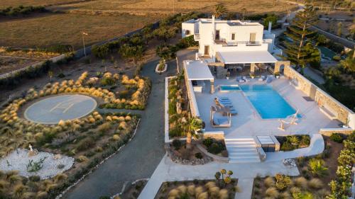 an aerial view of a villa with a swimming pool at Zoe & Zen Collection in Kampos Paros