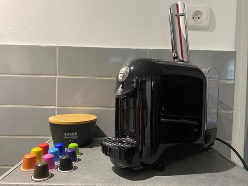 a toaster sitting on top of a kitchen counter at L'Escale ZEN in Tulle