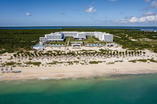 an aerial view of a resort on a beach at Riu Latino - Adults Only - All Inclusive in Costa Mujeres