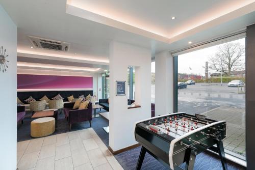 a room with a foosball table in a lobby at Holiday Inn Express Burnley M65 Jct 10, an IHG Hotel in Burnley