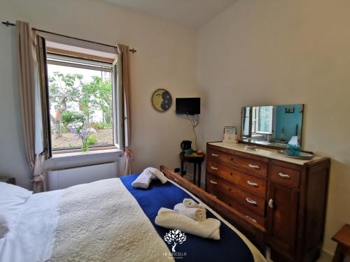 Letto o letti in una camera di La Suscella Bed & Breakfast