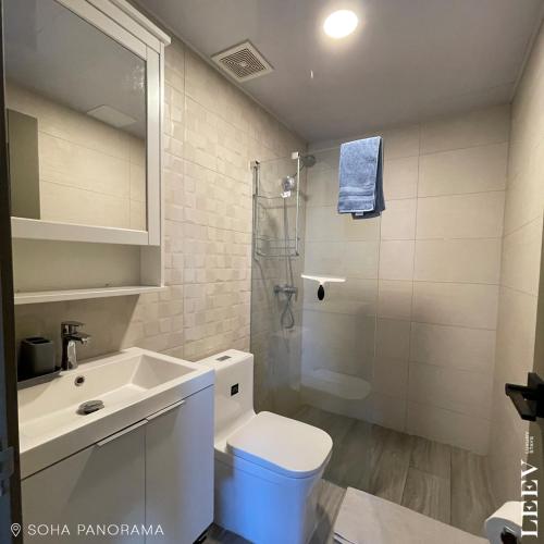 a bathroom with a sink and a toilet and a shower at Soha panorama- A14- 2 dormitorios in Santiago de los Caballeros