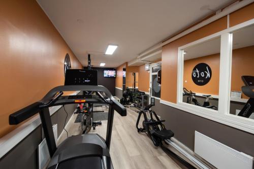 a gym with two bikes in a room at Koto Hotel Pihtipudas in Pihtipudas