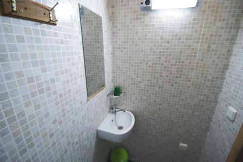 a bathroom with a sink and a mirror at Värava Farm in Pidula