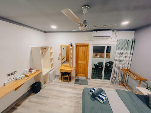 Postel nebo postele na pokoji v ubytování Mahchavaru Maldives