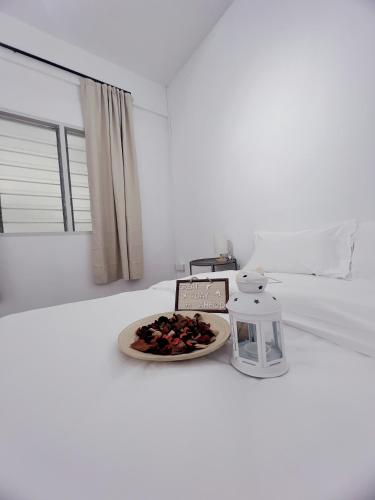 Tempat tidur dalam kamar di The Cozy Place by Nestcove