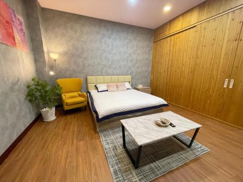 Cama o camas de una habitación en 鄉間小路 Home 備有專屬停車場