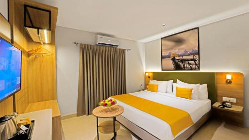 מיטה או מיטות בחדר ב-Click Hotel Biz - Bangalore Airport