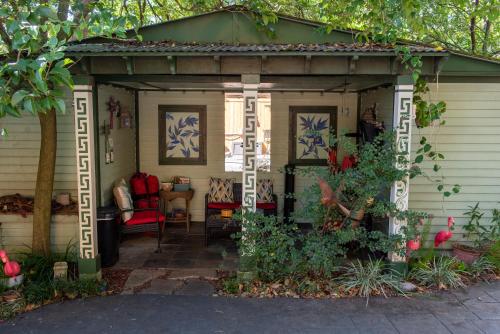 a shed with a red chair in it at The Lookout Inn in New Orleans