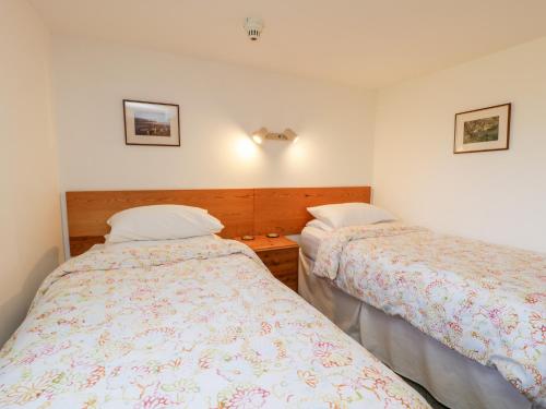 a bedroom with two beds in a room at Gateside in Pickering