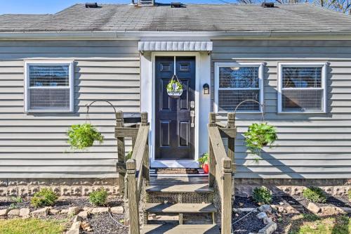 a blue house with a blue door and a porch at Anderson Bungalow Near University and Downtown! in Anderson