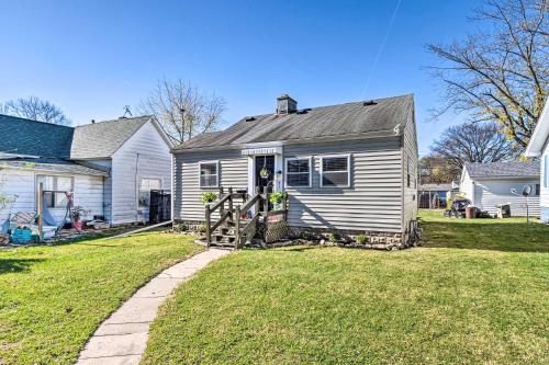 a small white house with a gate in a yard at Anderson Bungalow Near University and Downtown! in Anderson