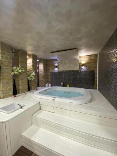 a large bathroom with a tub and a sink at Kopaonik Zoned 2 in Kopaonik