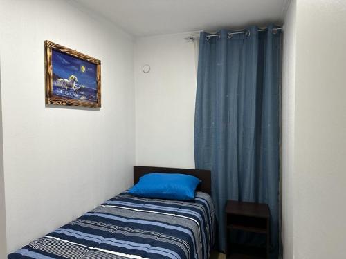 Tempat tidur dalam kamar di Departamento Alto la Paloma Valle Volcanes