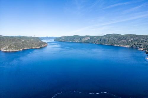 an aerial view of a large body of water at MontFJORD - Chalets, SPA et vue - ChantaFJORD #2 in Sacré-Coeur-Saguenay