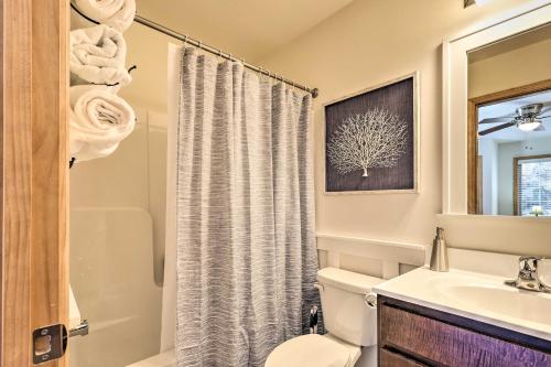 a bathroom with a toilet and a sink at Chestertown Hideaway with Lake and Beach Access! in Chestertown
