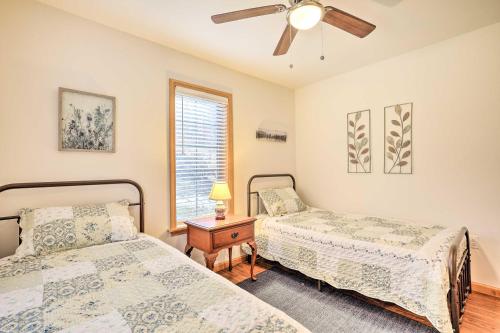 a bedroom with two beds and a ceiling fan at Chestertown Hideaway with Lake and Beach Access! in Chestertown