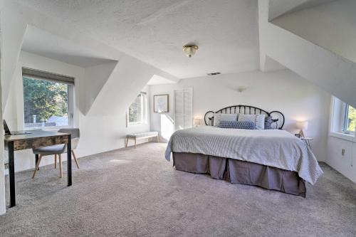 a white bedroom with a bed and a desk at Nevada City Escape Near Dtwn and Pioneer Park! in Nevada City