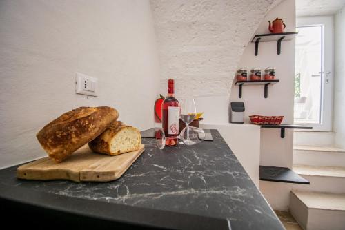 a loaf of bread on a counter in a kitchen at Masseria La Scalella - Cisterna in Manduria