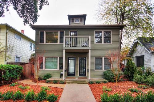a house with a porch and a balcony at Charming 2Bed French Colonial Apartment in Desirable Midtown Sacramento in Sacramento