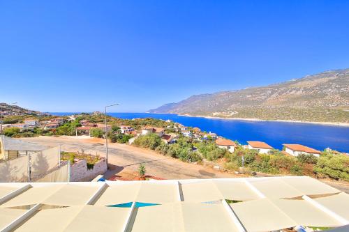 arial view of a town and a body of water at James Pansiyon Blue sea view villas Kaş Peninsula in Kas
