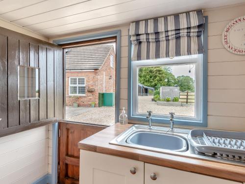 a kitchen with a sink and a window at The Nook in Louth