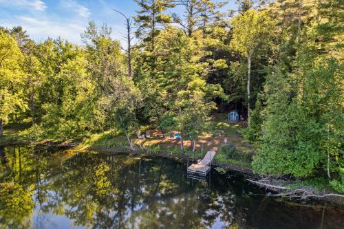 an aerial view of a river with a house at 6 Bedroom House at Schroon River in Brant Lake