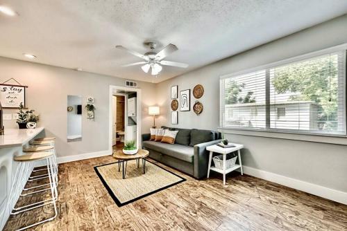 a living room with a couch and a window at Global Cup Lovely Dallas Flat Near Downtown in Dallas