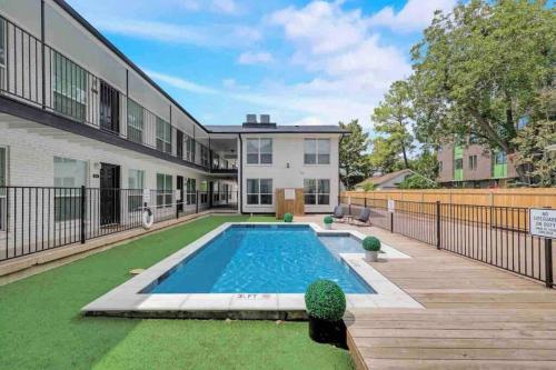 a swimming pool in the backyard of a house at Global Cup The City Escape & Arboretum Tickets Included in Dallas