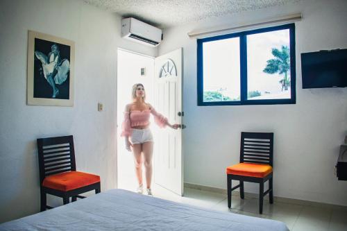 Postel nebo postele na pokoji v ubytování Hotel Cupules