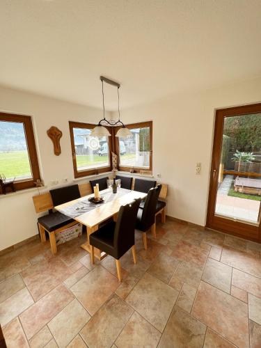 a dining room with a table and chairs at Apartment Malea in Schlitters