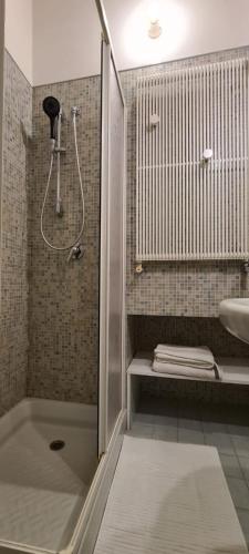 a bathroom with a shower and a sink at I Balconi sul Duomo in Lecce