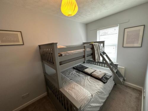 a bedroom with two bunk beds in a room at Cosy, 2 Bedroom Cottage in Guisborough Town Centre in Guisborough