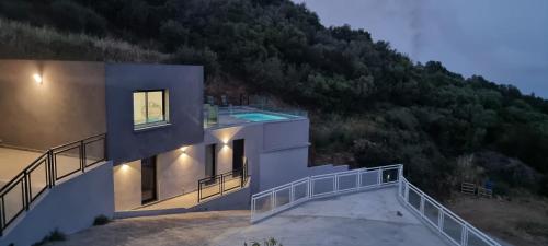 a house with a view of a mountain at Villa L'Alba BASTIA in Bastia