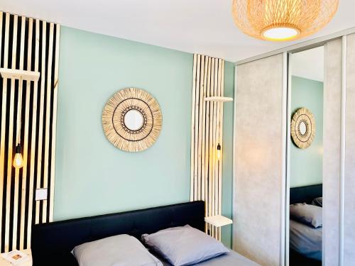 a bedroom with a bed and a mirror at La Contemporaine in Brax
