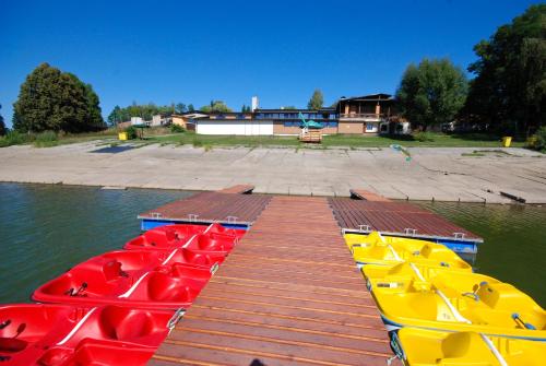 a group of boats parked next to a dock at Areál Přístav in Horní Soběšovice