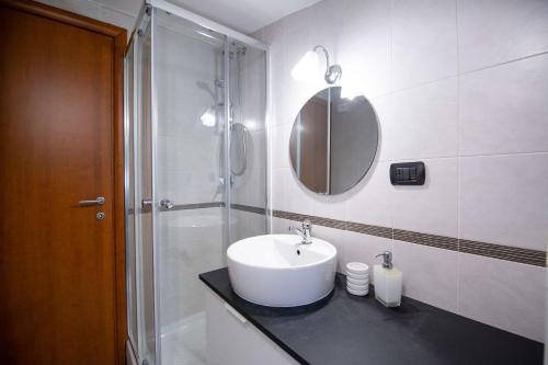 a white bathroom with a sink and a shower at B&B delle Meraviglie Salerno Hills in Pellezzano