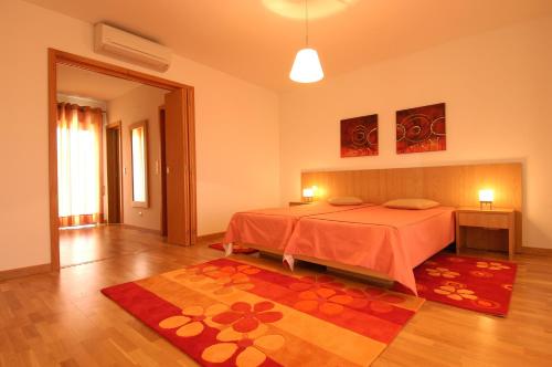 Postel nebo postele na pokoji v ubytování Orada Apartamentos Turísticos - Marina de Albufeira