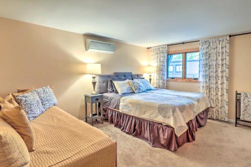 a bedroom with a bed and a window at Fantastic Tannersville Townhome with Epic Views in Tannersville