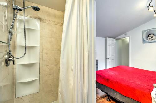 a bathroom with a shower and a red bed at Fantastic Tannersville Townhome with Epic Views in Tannersville