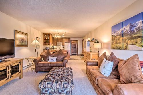 a living room with couches and a flat screen tv at Ski, Hike and Explore All-Season Frisco Condo in Frisco