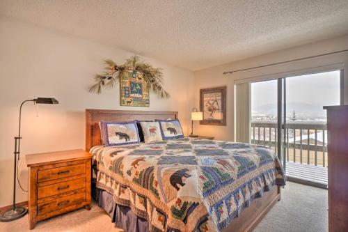 a bedroom with a bed and a large window at Ski, Hike and Explore All-Season Frisco Condo in Frisco